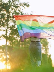 cropped-woman-running-with-rainbow-lgbt-flag-behind-back-2021-08-28-14-53-19-utc_compressed-scaled-1.jpg