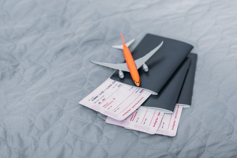 composition of flight tickets with toy airplane
