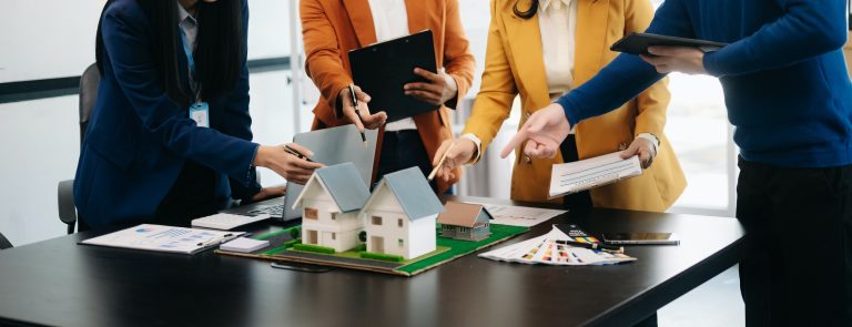 balancing the property sector The real estate agent is explaining the house style to see the house